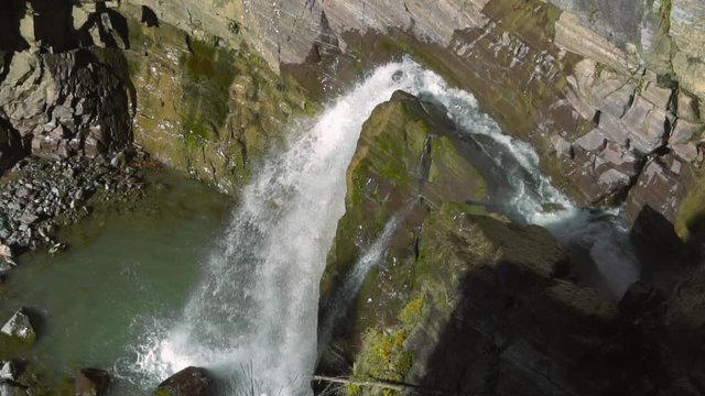Motion Blur Waterfalls Peaceful Nature Landscape in Mountains. Waterfall at small river near Rosa Khutor resort in Caucasus mountains.
