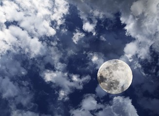 Naklejka na ściany i meble Full moon behind clouds
