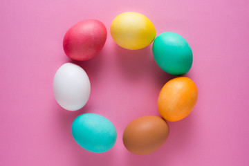 Easter eggs on a pink background from above