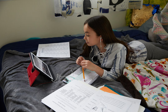 Kids e-learning at home during coronavirus COVID-19 restrictions and closed schools