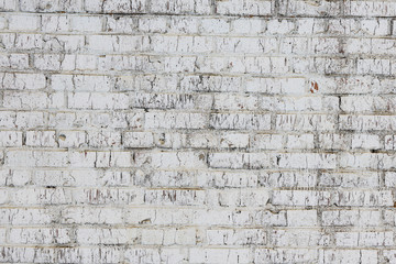Old wall made of red brick, painted white in loft style for modern designer interior of room, bar or restaurant