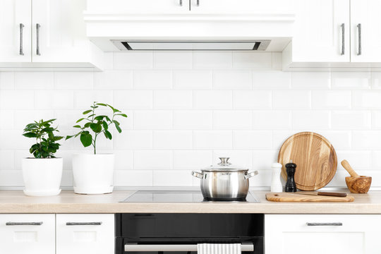 White Modern Kitchen Interior With Wooden Worktop And Kitchenware, Culinary Concept, Background