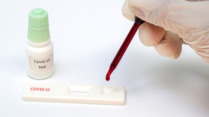Rapid test kit for coronary virus covid-19,Vaccine contained in a syringe on a white background,
