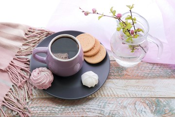 A cup of coffee, meringues, flowering branches of cherry on the windowsill, spring, morning, home rest