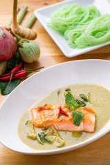 Kanom Jeen Salmon green curry on white dish. Thai noodles green curry soup.