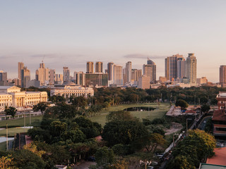 Fototapeta premium Intramuros Golf Club with the Skyline of Manila in the background