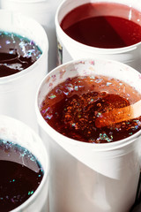 Multi-colored paste for depilation. Texture of honey paste to remove hair.