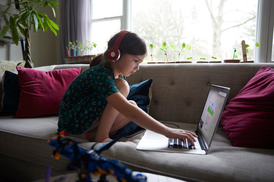 Kids e-learning at home during coronavirus COVID-19 restrictions and closed schools