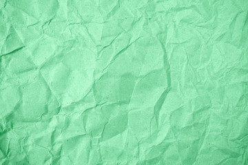 Ancient green crumpled paper for background