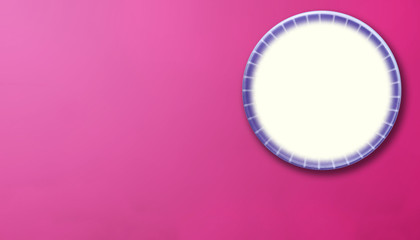 round ceramic plate on pink background with negative space or copy space