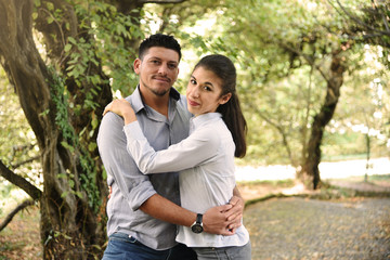 Good Looking Couple Hugging in a Park