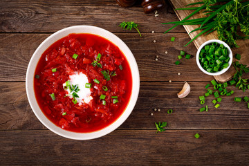 Traditional ukrainian borscht, vegetable soup with tomato, beet, carrot, potato, pepper, cabbage...