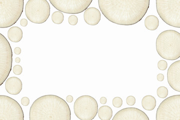 Background frame from slices of black radish of different sizes with copy space.