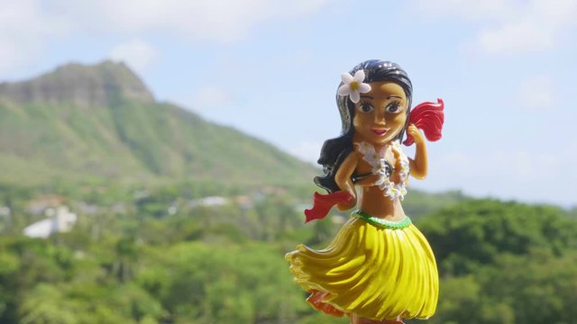 Hula Girl Doll dancing on the hawaiian background in 4K Slow motion 60fps
