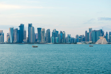 Obraz premium View of modern skyscrapers and bay at twilight in Doha, Qatar