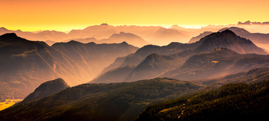 View from the Donnerkogel with layers of Mountains and the valley