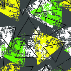 Yellow, green, white and black triangle with grunge texture on a gray background. Seamless pattern.