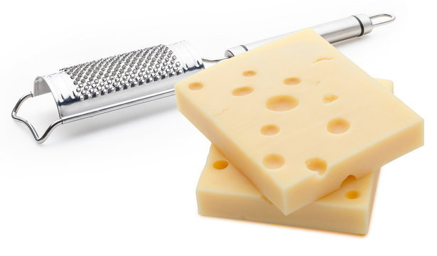 Two portions (blocks) of Emmental Swiss cheese with a grater. Texture of holes and alveoli. Isolated on white background.
