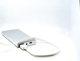 power bank with usb line connect on isolated white background with copy space