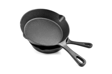 Cast iron pans isolated on white background. Two black empty skillets. Kitchen equipment, cookware