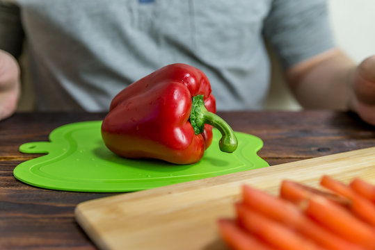 red bell pepper on a sliced Board