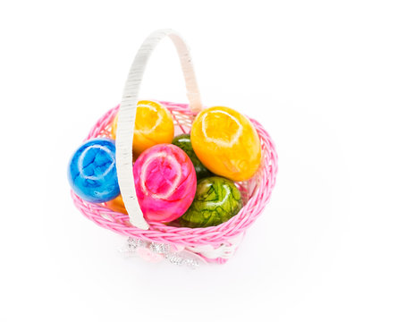 colorful easter eggs in plastic basket