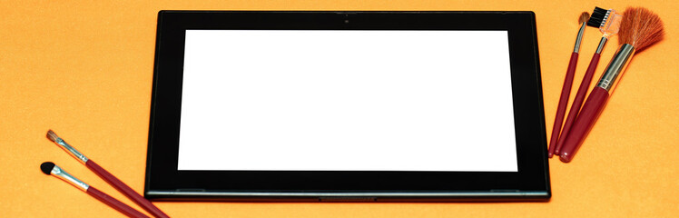 Obraz premium the concept of an online cosmetics store on an orange background