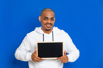 African guy wearing a white sweatshirt