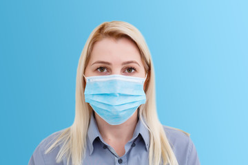 Businesswoman with protecting mask on her lips