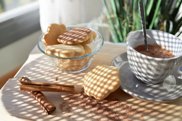 Cookies with milk and cinnamon stick