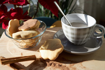 Cookies with christmas poinsettia flower background