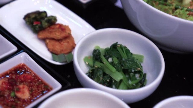 Variety of Korean side dishes full table bbq meal