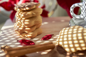 Cookies with christmas poinsettia flower background