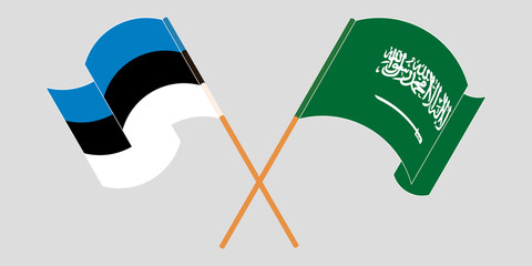 Crossed and waving flags of Estonia and the Kingdom of Saudi Arabia