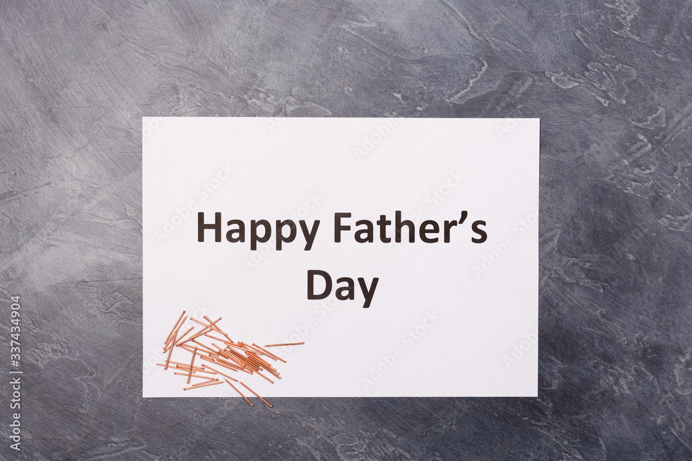 Wall mural Happy father's day text picture frame on black desk with nails. Copy space. Holiday concept. Happy father 