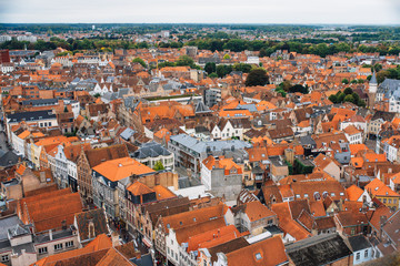 Fototapeta na wymiar Panoramic view from the Belfort tower on the historic part of Bruges and the Cathedral of St. Salvator, the main pedestrian street with many shops, Belgium. Travel to Belgium.