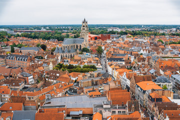 Naklejka premium Panoramic view from the Belfort tower on the historic part of Bruges and the Cathedral of St. Salvator, the main pedestrian street with many shops, Belgium. Travel to Belgium.