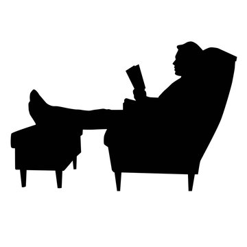 man sitting in armchair with legs on footstool and reeding book black vector silhouette isolated on white background