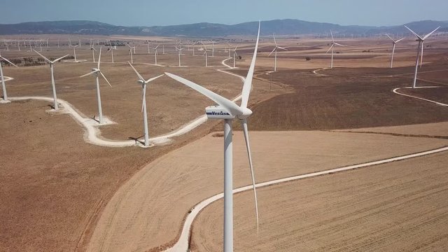 Aerial drone view of wind turbine farm producing renewable energy in south-west of Spain, Tarifa , Cadiz. Friendly environment concept and green energy.   