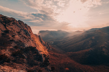 Mountains in the fog at sunset