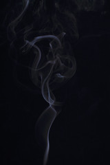 Abstract white smoke texture on black background