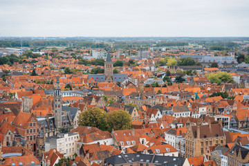 Fototapeta na wymiar Panoramic view from the Belfort tower on the historic part of Bruges and the Cathedral of St. Salvator, the main pedestrian street with many shops, Belgium. Travel to Belgium.