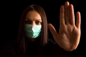 Stop coronavirus. Young white woman wearing face mask.
