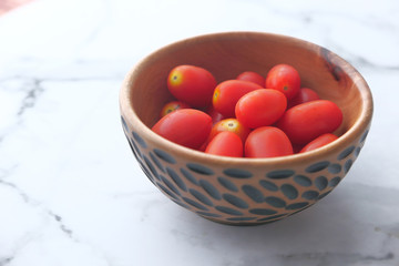 close up cherry tomato in a bowl.