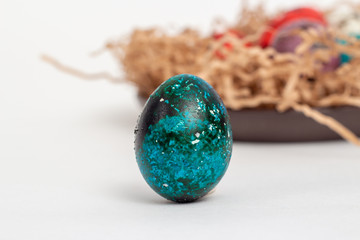 Multi-colored quail eggs for Easter in the filler