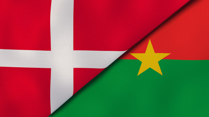 The flags of Denmark and Burkina Faso. News, reportage, business background. 3d illustration