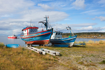 Fototapeta premium Punta Arenas, Chile, Fishing boats on the shore. Fishing has long been the main occupation of Patagonia.