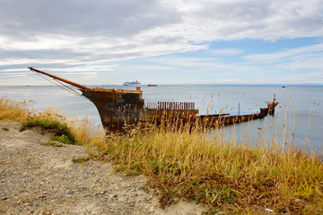 Fototapeta na wymiar Punta Arenas, Chile, Remains of an old sea vessel near the coast. This is the remains of the frame of the English frigate 