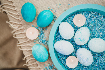 Easter painted blue eggs. Happy Easter card. Top view, flatlay. Easter bunny rabbits. Pastel background