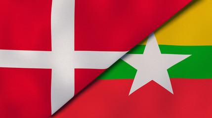 Fototapeta premium The flags of Denmark and Myanmar. News, reportage, business background. 3d illustration